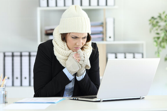woman in beanie and sweater too cold